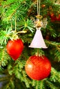 Red sphere, red heart and glass angel on Christmas tree Royalty Free Stock Photo