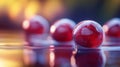Red Spheres Resting On Water With A Blurred Background Royalty Free Stock Photo