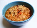 Colorful asian noodles and blue bowl