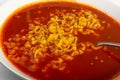 Red Spicy Noodle Soup in White Bowl, Hot Chili Pepper Ramen Closeup Royalty Free Stock Photo