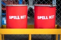 Red spill kit containment boxes.