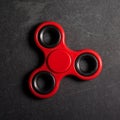Red spinner Fidget finger stress anxiety relief toy.