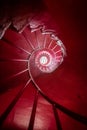 Red spiral staircase low angle vertical view Royalty Free Stock Photo