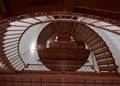 Red spiral staircase viewed from below looking up Royalty Free Stock Photo