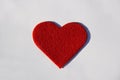 Red spongy heart on white paper background Royalty Free Stock Photo