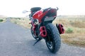 Red sport bike stands on the track Royalty Free Stock Photo