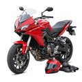 Red sport motorcycle with sleek aerodynamic design, featuring a windshield and dual headlights. Royalty Free Stock Photo