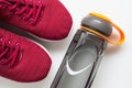 Red sport shoes and bottle of water. Active healthy lifestyle background concept. Fitness and wellness healthy living, dieting Royalty Free Stock Photo