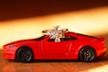 The red sports car bears a ring with a white crystal. Royalty Free Stock Photo