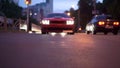 Red Sports Car Coupe Rear View In The Street. Classic powerful car in the city traffic.