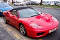 Red sports car ferrari convertible parking on road in France Royalty Free Stock Photo