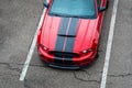 Red sports car Ford Mustang outside in the parking lot