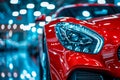 Red sports car with its headlights on in garage. Generative AI Royalty Free Stock Photo