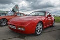 Red sports car rear wheel drive porsche 944 turbo 1987 on exhibition of retro cars