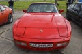 Red sports car rear wheel drive porsche 944 turbo 1987 on exhibition of retro cars