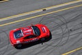 The red sports car is standing in front of the racing circuit in Brno, Czech Republic, and is ready for the race. Royalty Free Stock Photo