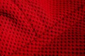 Red sportswear closeup top view. seam and juncture. breathable knitwear. clothing details macro Royalty Free Stock Photo