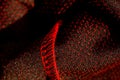 Red sportswear closeup top view. seam and juncture inside out. breathable knitwear. clothing details macro Royalty Free Stock Photo