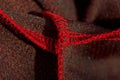 Red sportswear closeup top view. seam and juncture inside out. breathable knitwear. clothing details macro Royalty Free Stock Photo