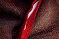 Red sportswear closeup top view. seam and juncture inside out. breathable knitwear. clothing details macro Royalty Free Stock Photo