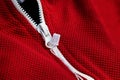 Red sportswear closeup top view. white zip line. breathable knitwear. clothing details macro Royalty Free Stock Photo