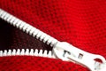 Red sportswear closeup top view. white zip line. breathable knitwear. clothing details macro Royalty Free Stock Photo