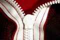 Red sportswear closeup top view. white zip line on the wrong side. breathable knitwear. clothing details macro Royalty Free Stock Photo