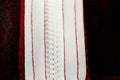 Red sportswear closeup top view. white zip line on the wrong side. breathable knitwear. clothing details macro