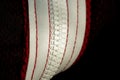 Red sportswear closeup top view. white zip line on the wrong side. breathable knitwear. clothing details macro Royalty Free Stock Photo