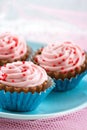 Red sprinkles on pink cupcake chocolate bonbons