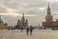 Red Square during autumn with people and the iconic St. Basil`s Cathedral and Spasskaya Tower in Moscow, Russia. Royalty Free Stock Photo