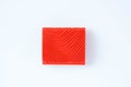 Red square rubber decorative stamp for simulating a wood texture on white background Royalty Free Stock Photo
