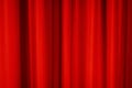 Red stage curtain with folds, fabric texture