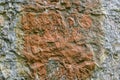 Close up of a piece of limestone with a centre red stain
