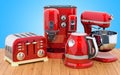 Red stainless electric tea kettle, coffeemaker, toaster, mixer.