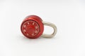 Red stainless steel lock on a white background