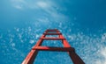 Red Staircase Rests Against Blue Sky, Front View. Development Motivation Career Growth Concept Royalty Free Stock Photo