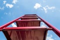 Red stairs rest against the blue sky Royalty Free Stock Photo