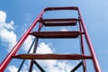 Red stairs rest against the blue sky Royalty Free Stock Photo