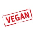 Red stamp and text Vegan.