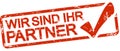 red stamp with text Wir sind ihr Partner Royalty Free Stock Photo