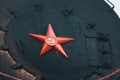 A red star with a sickle and a hammer is a symbol of the Soviet Union.