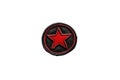 Red Star Sits on a Black Background, a Symbolic Representation. A Bold Patch Royalty Free Stock Photo