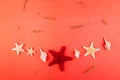 Red starfish background. Summer vacation concept. Flat lay. Royalty Free Stock Photo