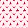 Red starfish seamless repeat symmetrical pattern on light pink background.