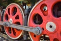 Red steam locomotive wheels, metal wheels of an old steam locomotive