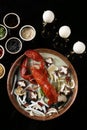 Red steamed lobster with mushroom in plate on black background Royalty Free Stock Photo