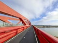 Red steel bridge called Hanzeboog over the river IJssel between Hattem and Zwolle