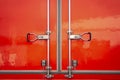 Red Steel Door Safety lock of Cargo Truck. Royalty Free Stock Photo