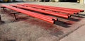 Red steel pipes for fire fighting system and extinguishing water lines in industrial building. Paint shop. Steel pipe painted red Royalty Free Stock Photo